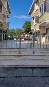 a set of stairs in front of a building at CONDOMINIO MAURIZIO A MARE in Scerne +4 photos