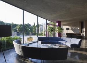 a living room with a couch and a table at Leivatho Hotel in Svoronata