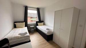 Postel nebo postele na pokoji v ubytování 3-Zimmer Monteurwohnung mit Balkon