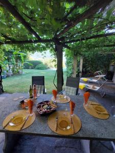 a table with plates of food on top of it at Auf dem Regenbogen in Morcote