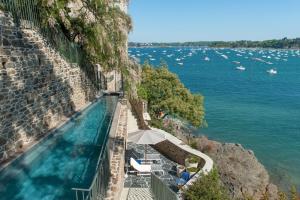 a view of a body of water with boats at Castelbrac Hotel & Spa in Dinard