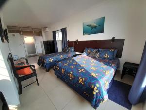 Postel nebo postele na pokoji v ubytování Umkomaas Lodge