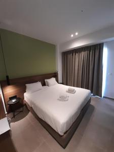 Postel nebo postele na pokoji v ubytování Astron Hotel Rhodes