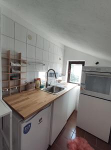 a kitchen with a sink and a counter top at Park 2 Branka FREE PARKING in Vranje