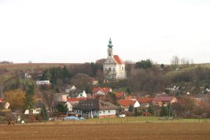 a village with a church on top of a hill at ONE Self-Check-In, 3km freeway 