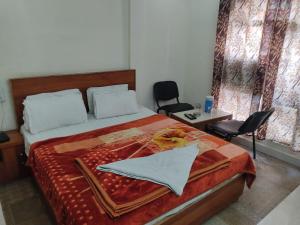 Кровать или кровати в номере Hotel pleasure palace