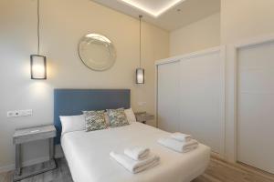 Posteľ alebo postele v izbe v ubytovaní Fresh Velazquez Apartments