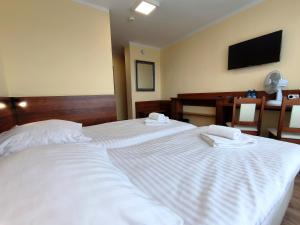 Postel nebo postele na pokoji v ubytování Hotel SiLL