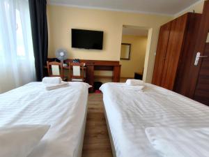 Postel nebo postele na pokoji v ubytování Hotel SiLL