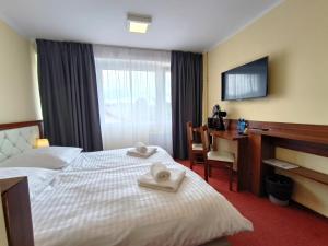 Postel nebo postele na pokoji v ubytování Hotel SiLL