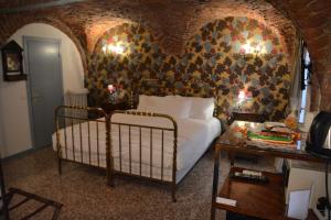 Postel nebo postele na pokoji v ubytování Ca' Monteggia Guest House