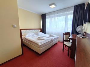 Postel nebo postele na pokoji v ubytování Hotel SiLL