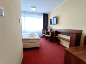 Postel nebo postele na pokoji v ubytování Hotel SiLL
