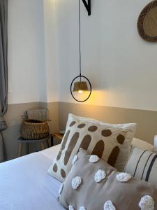 a bedroom with a bed with two pillows on it at thēama Corfu in Marathias