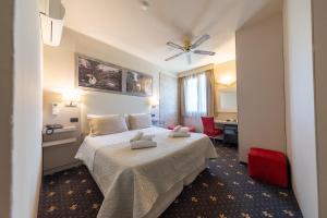 Postel nebo postele na pokoji v ubytování Holiday Rooms Antica Badia