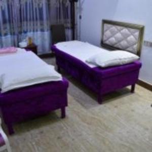 Postel nebo postele na pokoji v ubytování Wuduria Hotel