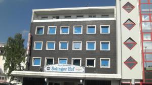 a building with a sign on the side of it at Hotel Solinger Hof in Solingen