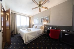 Postel nebo postele na pokoji v ubytování Holiday Rooms Antica Badia