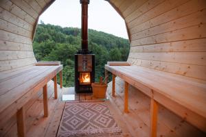 an inside view of a sauna with a wood stove at Resort TimAJA - pool, massage pool, sauna in Trebnje