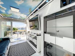 a living room with a view of the ocean at 24 Appart Tropic Deluxe in Cap d'Agde