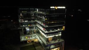 an overhead view of a tall building at night at Hotel Nobilis Hall in K'obulet'i