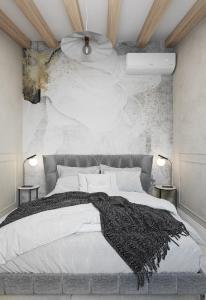 a bedroom with a bed with a black blanket on it at Holiday Home Nico's in Cavtat +29 photos