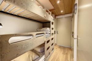 a room with two bunk beds and a closet at Rare pearl with incredible views in Les Houches