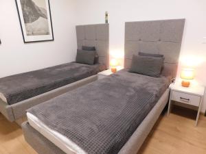 Postel nebo postele na pokoji v ubytování Wellness Rezort Tatranská Štrba