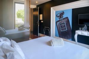 Кровать или кровати в номере RM The Experience - Small Portuguese Hotels