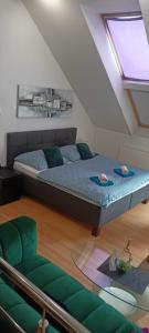 a large bed in a room with a window at LUX & Comfort in Košice