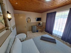 Sleep 'n Go Guesthouse客房内的一张或多张床位
