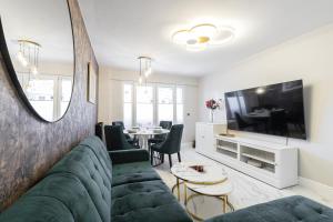 a living room with a couch and a table at St George in Antibes