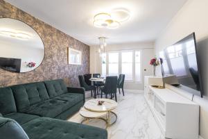 a living room with a couch and a table at St George in Antibes