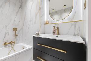 a bathroom with a sink and a mirror at St George in Antibes