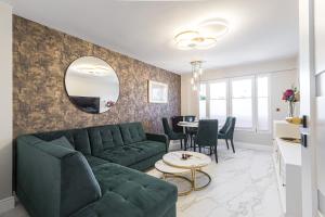 a living room with a couch and a table at St George in Antibes
