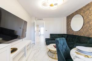 a living room with a couch and a table at St George in Antibes