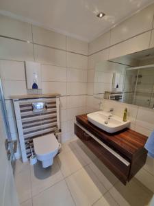 a bathroom with a sink and a toilet at The Valley 2 bedroom Apartment in Side
