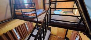 an overhead view of a room with two bunk beds at หวานใจ โฮมสเตย์ (Whanjai Homestay) in Laem Ngop