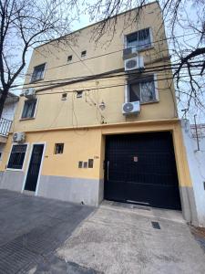 a large building with a large garage door at La Escala in Corrientes