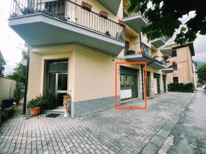 a building with an orange mirror on the side of it at Holiday Studio Castel di Sangro in Castel di Sangro