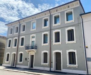 a large white building with a balcony on it at Star Soave Rooms - Locazione Turistica in Soave