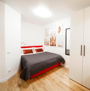 a bedroom with a bed in a white room at MYFREEDOM Апартаменти Інститут Серця in Kyiv