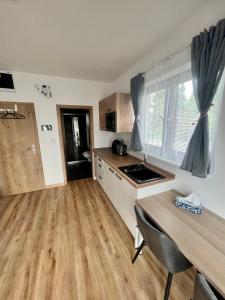 Kuchyň nebo kuchyňský kout v ubytování Apartmán Roda1 Malé Lipno