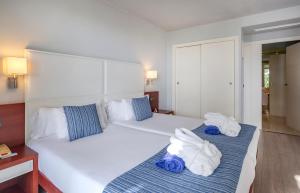 A bed or beds in a room at Marins Suites - Adults Only Hotel