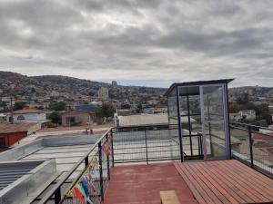 a building with a glass door on top of a roof at Room in Lodge - I Valparaluz House 4 People, Private Bathroom in Valparaíso