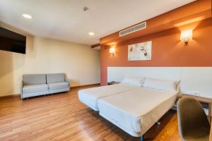 Cama o camas de una habitación en Checkin Madrid Móstoles