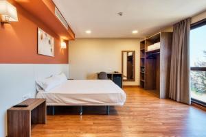 Cama o camas de una habitación en Checkin Madrid Móstoles