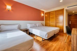 Cama o camas de una habitación en Checkin Madrid Móstoles