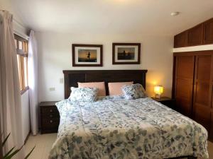 a bedroom with a bed with two pillows on it at Charming 1-Bed Studio in Huanchaco with balcony in Huanchaco