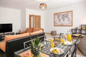 a living room with a table with food on it at Ferrel Apartment in Ferrel